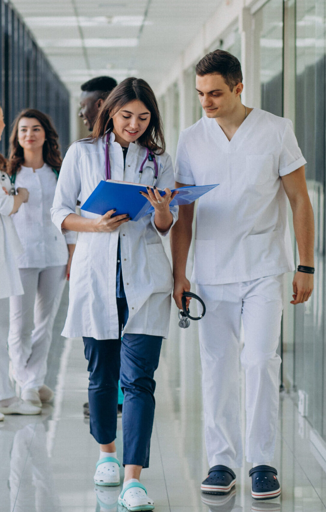 team young specialist doctors standing corridor hospital